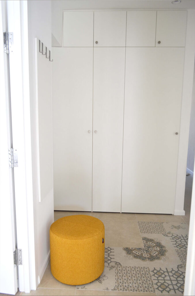 Mustard yellow puff in a white interior